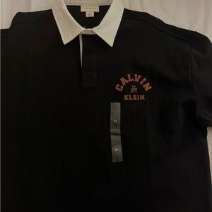 Brand New Calvin Klein Black Polo Shirt with White Collar